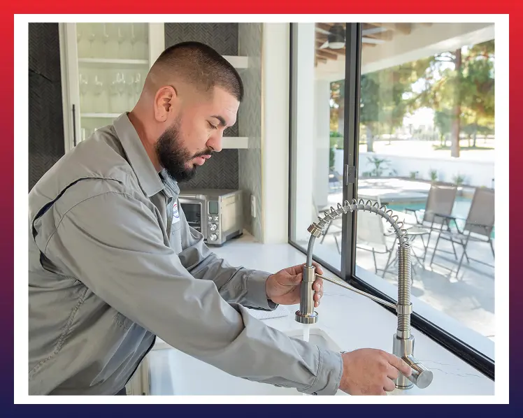 Comfort Air technician working on a kitchen fixture